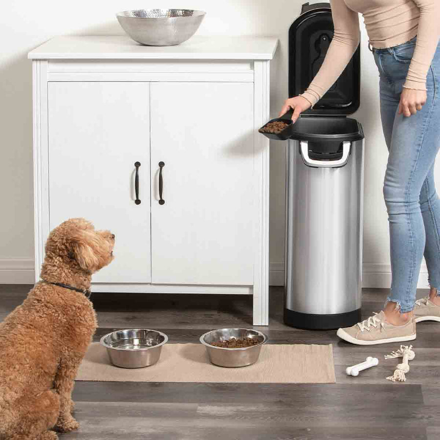 x-large pet food bin - lifestyle woman scooping food