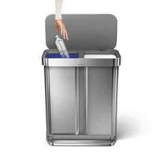 58L dual compartment rectangular pedal bin with liner pocket - brushed stainless steel - hand dropping bottle in can image