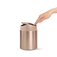 mini bin - rose gold stainless steel w/ pink trim - lifestyle hand image